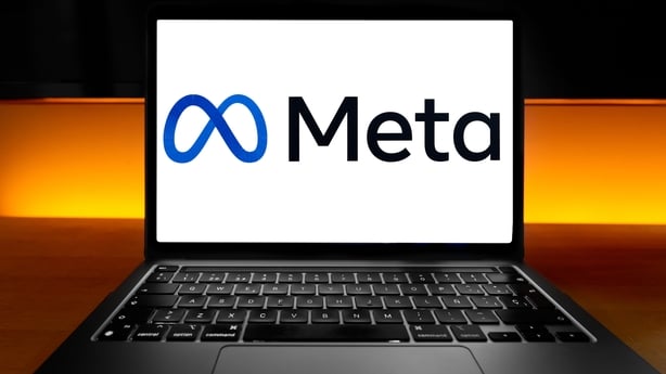 a laptop with Meta logo on the screen