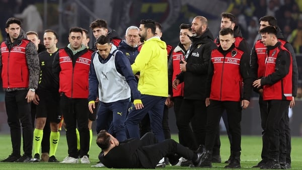 Okan Buruk hits the deck after clashing with Mourinho