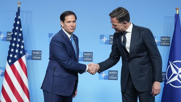 Marco Rubio shakes hands with Mark Rutte as he meets NATO counterparts in Brussels