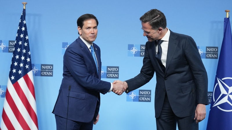Marco Rubio shakes hands with Mark Rutte as he meets NATO counterparts in Brussels