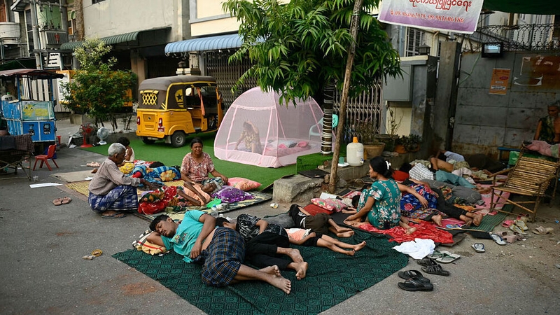 People sleep in the open on the ground in Mandalay one week on since the 7.7 earthquake