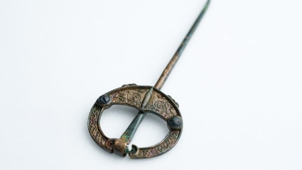 The brooch pin made of cast bronze is 12cm in length
