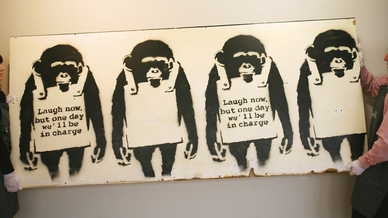 The two men allegedly took the limited edition print of Banksy's iconic 'Laugh Now' image (file image)