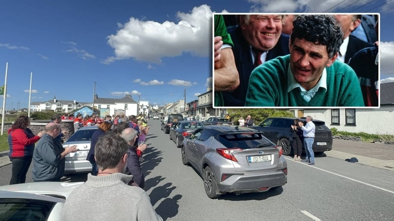 Many people lined the streets and applauded as the cortège made its way through the village, pausing outside Mick O'Dwyer's (inset) pub and at the local GAA pitch