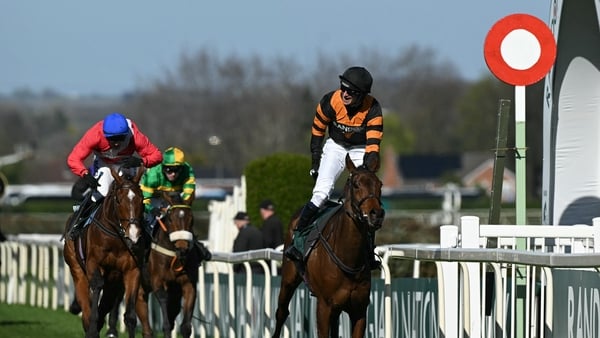 Patrick Mullins reacts as he passes the finish line on Nick Rockett