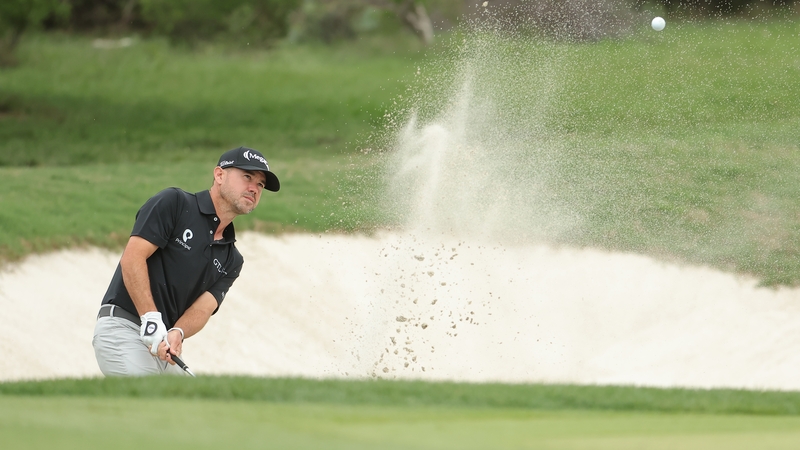 Brian Harman plays a shot from a bunker on the 14th hole at TPC San Antonio
