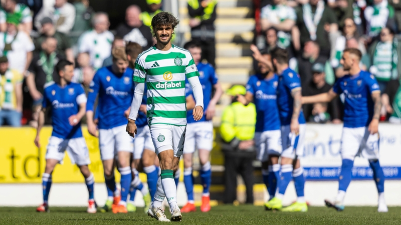 Celtic's Jota as St Johnstone celebrate their goal in the background