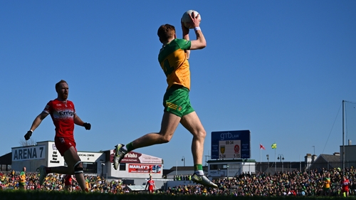 Ciaran Moore of Donegal gathers possession around the middle against Derry