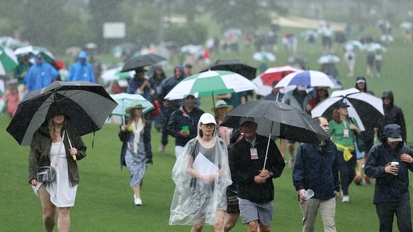 Patrons make their way for the exits at Augusta National