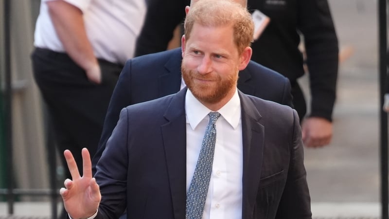 Prince Harry waved as he arrived at the Royal Courts of Justice in London