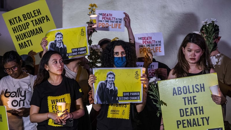 Activists seen at a vigil against the execution of Pannir Selvam Pranthaman, sentenced to death for drug trafficking into Singapore, outside the Singaporean embassy in Kuala Lumpur, Malaysia, on 19 February