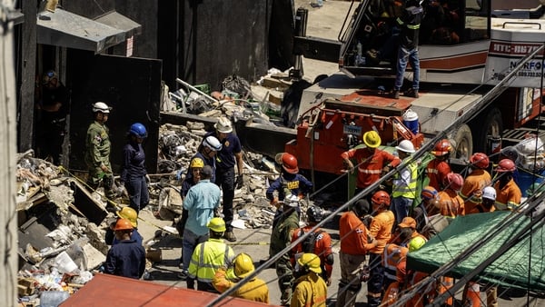 Personnel from civil defence and firefighters search for survivors at the Jet Set nightclub