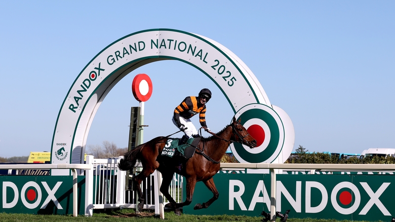 Nick Rockett ridden by Patrick Mullins celebrates as they cross the line to win the Randox Grand National Handicap Chase during Grand National Day