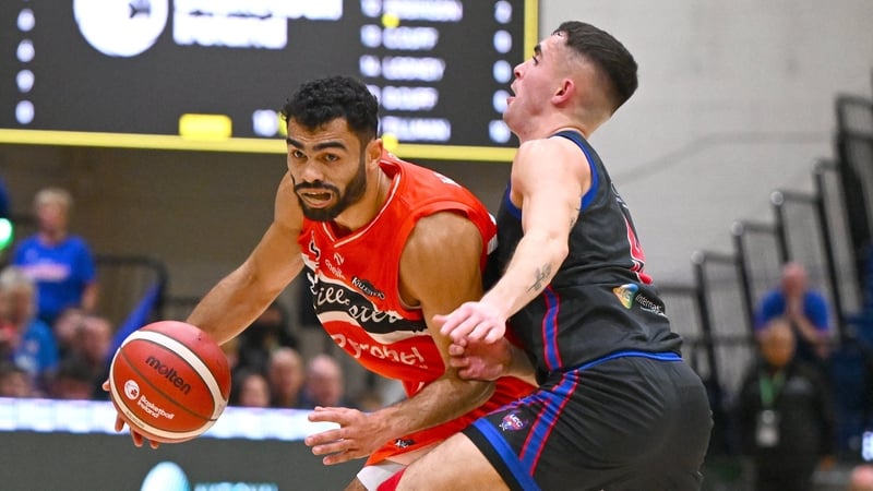 Kason Harrell of Killester in possession against Kyle Hosford of UCC during National Cup final