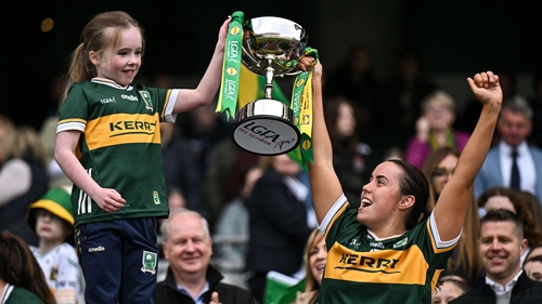 Danielle O'Leary lifts the trophy with Grace Dumigan, from Killarney, following their National Football League final win