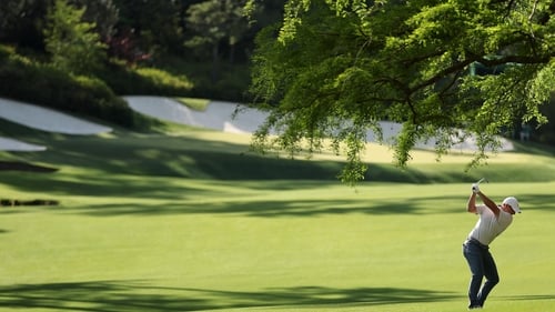 McIlroy plays his second to the par-five 13th