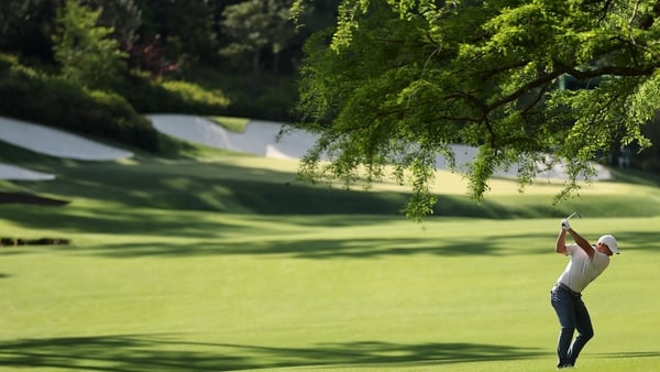 McIlroy plays his second to the par-five 13th