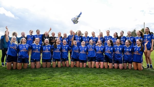Cavan celebrate their win as the cup goes airborne