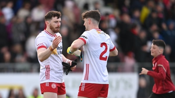 Rory Brennan and Aidan Clarke embrace at the end of Tyrone's win
