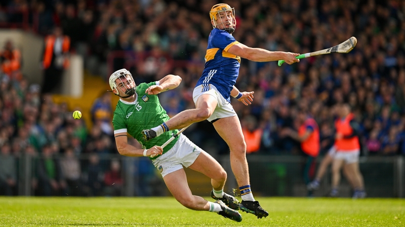 Tipperary's Ronan Maher (R) and Limerick's Aaron Gillane contest a dropping ball during the 2024 Munster Senior Championship