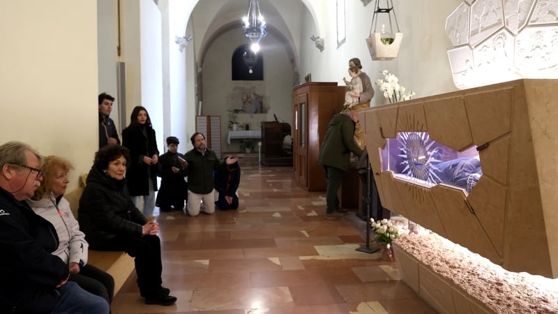 Crowds gathered at the clear-sided casket of Carlo Acutis in Assisi, Italy