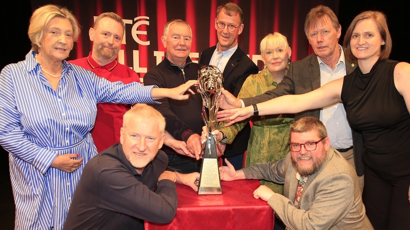 Representatives of the nine 2025 RTÉ All-Ireland Drama Festival (AIDF) finalists with the Perpetual Trophy