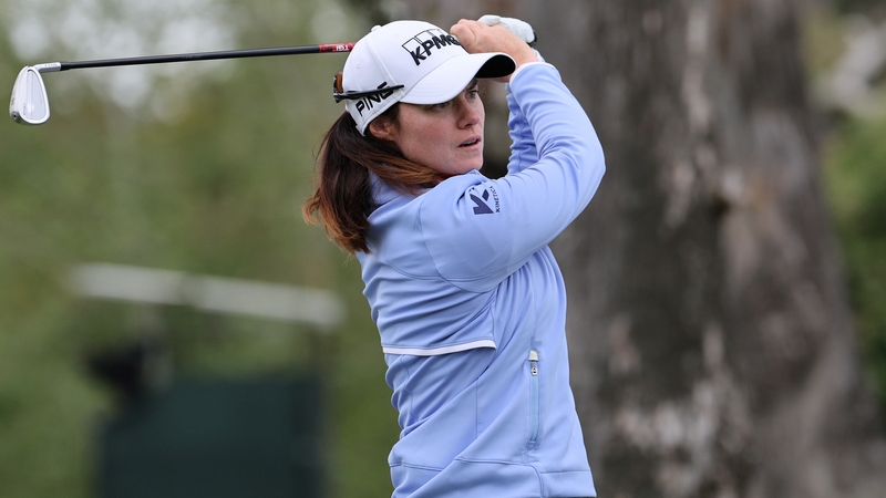 Maguire watches her tee shot from the 17th