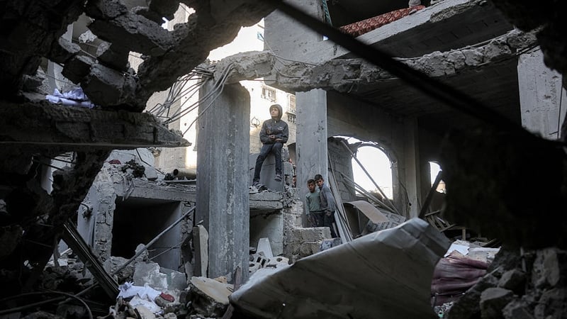 Boys inspect the rubble of a destroyed building that was hit by Israeli bombardment in Jabalia in northern Gaza