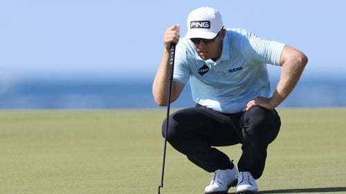 Seamus Power lines up a putt during his second round