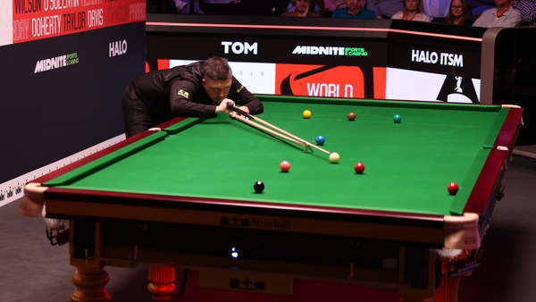 Kyren Wilson plays a shot with the rest in Sheffield