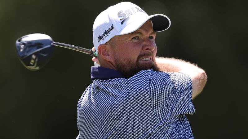 Shane Lowry hits his drive on the ninth hole