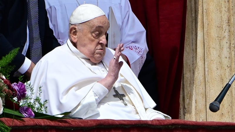 Pope Francis waved to the gathered crowds from the balcony