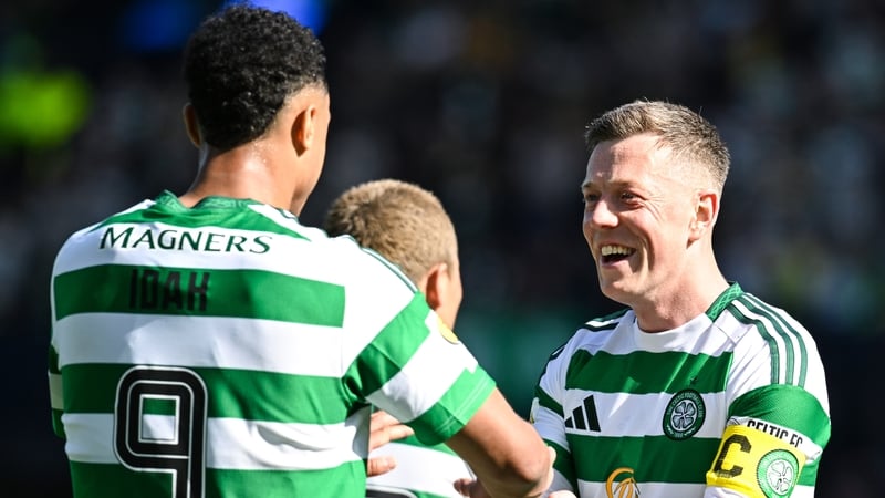 Adam Idah (L) celebrates scoring to make it 3-0 with his captain Callum McGregor