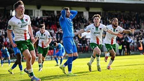 Cork City players celebrate their second goal against Waterford