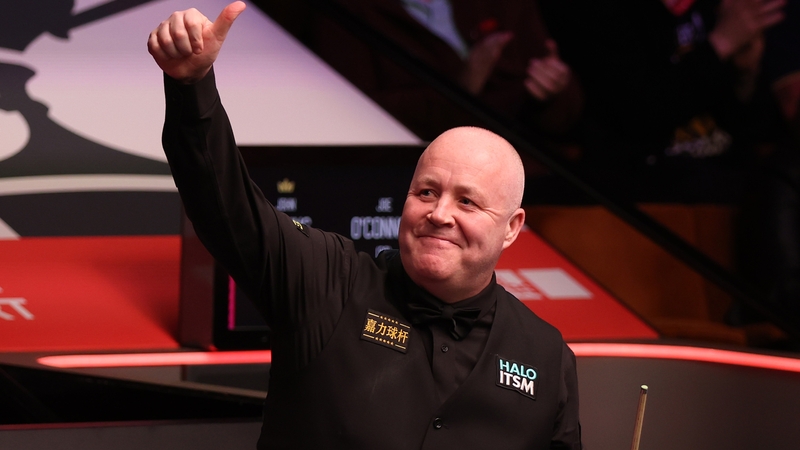John Higgins acknowledges the crowd in Sheffield after his win