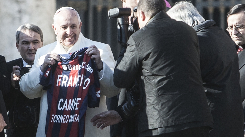 Pope Francis previously presented with a red and blue San Lorenzo team jersey
