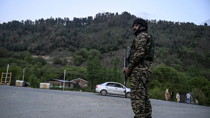 Indian paramilitary forces stand guard near Pahalgam following an attack the attack