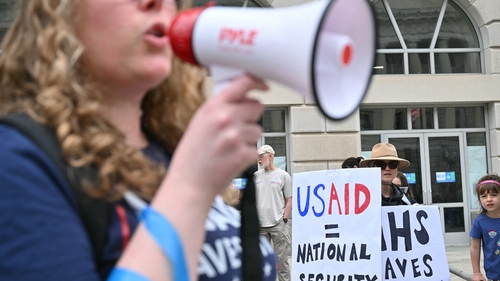 Demonstrators outside USAID offices on 5 April for a nationwide 'Hands Off!" protest against DOGE cuts