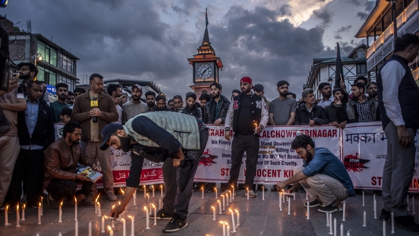 Kashmiri traders hold a candlelight vigil to denounce the gunmen's attack on tourists