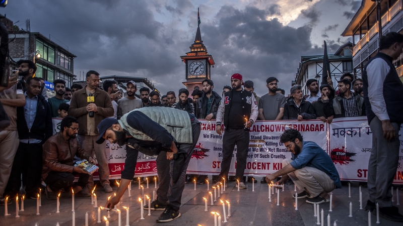 Kashmiri traders hold a candlelight vigil to denounce the gunmen's attack on tourists