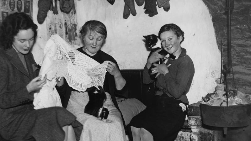 Actress Maureen O'Sullivan (1911 - 1998, left) buying Irish lace at a cottage in Wicklow, circa 1938. Photo: Getty Images