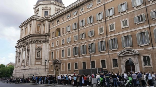 Visitors queue to enter Santa Maria Maggiore basilica, where the Pope is set to be buried