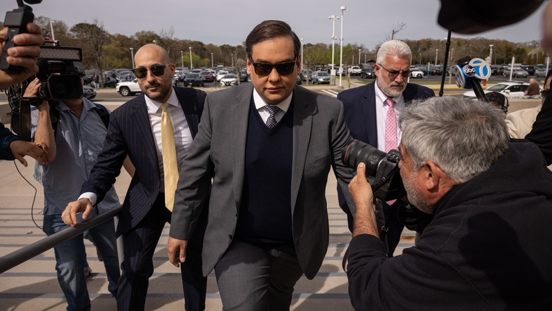 George Santos arriving at the federal court in Central Islip, New York, today