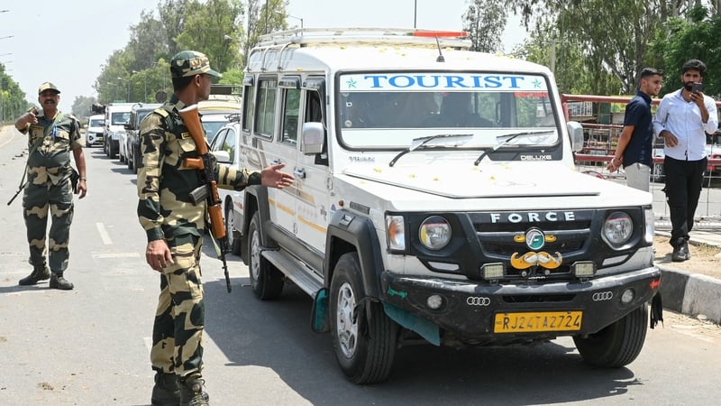 Indian soldiers stand guard at the India-Pakistan Wagah border