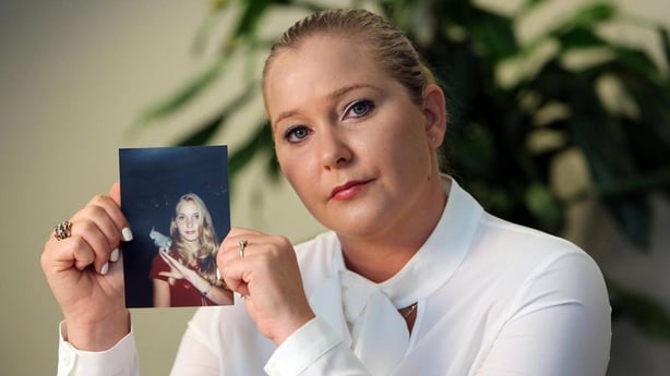 Virginia Roberts Giuffre with a photo of herself as a teen