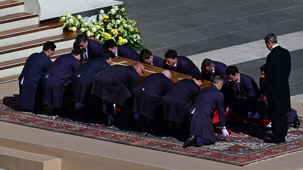 Pallbearers with the coffin
