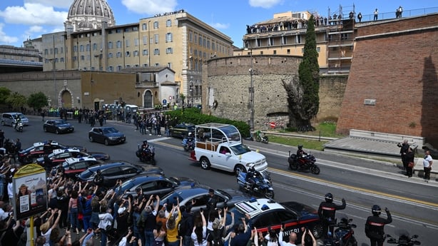  People gather along the road as the coffin of late Pope Francis is transported from St Peter's Basilica (top L) to Santa Maria Maggiore Basilic