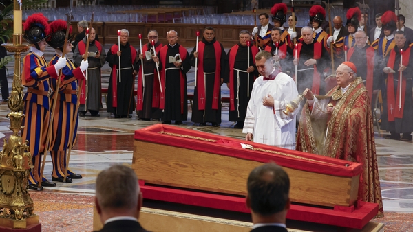 Cardinal Camerlengo Kevin Joseph Farrell blesses the open casket containing the body of Pope Francis
