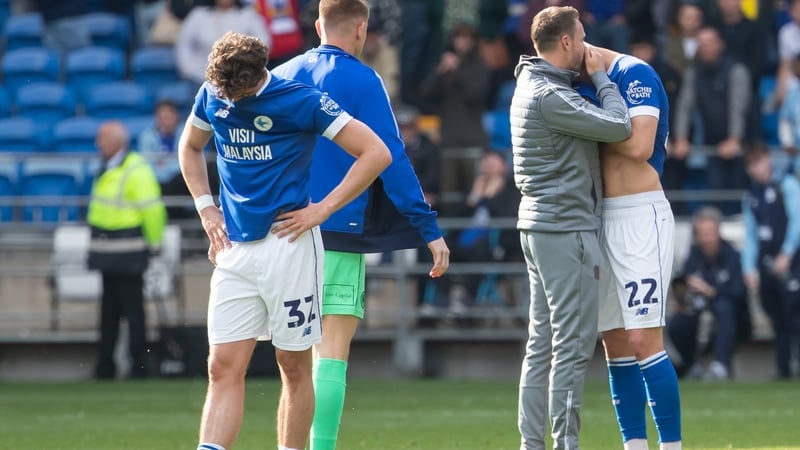 Cardiff players Ollie Tanner (L) and Yousef Salech after relegation was confirmed