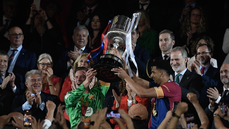 Barcelona goalkeeper Marc-Andre Ter Stegen and defender Ronald Araujo lift the Spanish Cup trophy